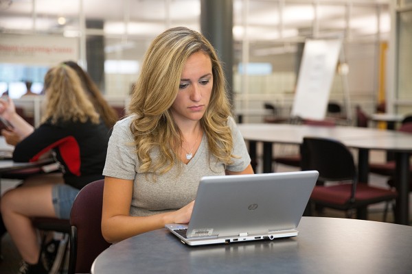 Concerned woman using laptop