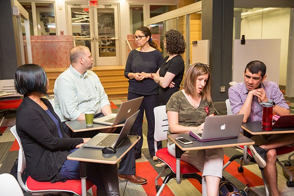 a group of instructors at Kickstart Week talk together