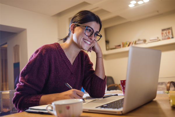Woman smiling at computer