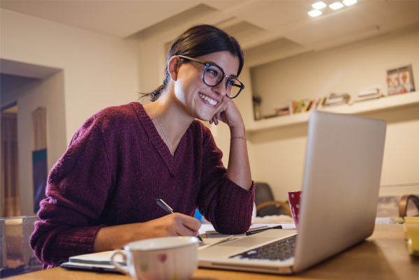 Woman smiling at computer 