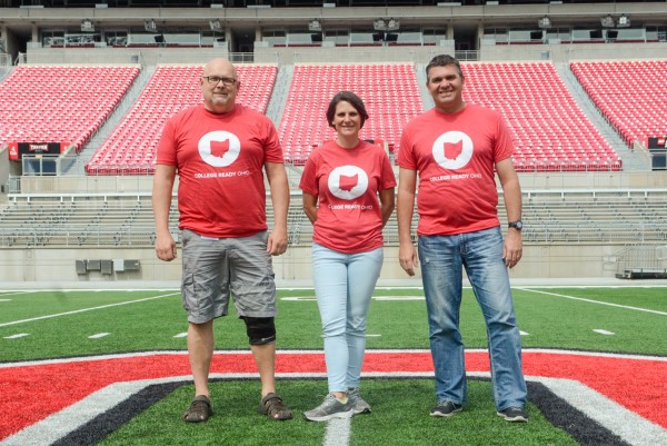 Three teachers from Hilliard City Schools pose wearing College Ready Ohio T-shirts.