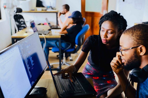 Instructor helping student with code
