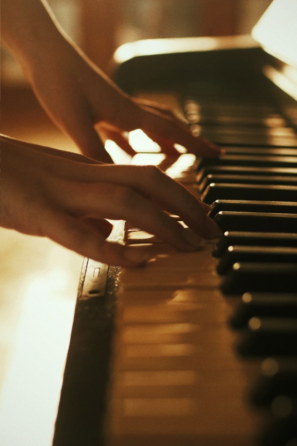 A pair of hands playing piano