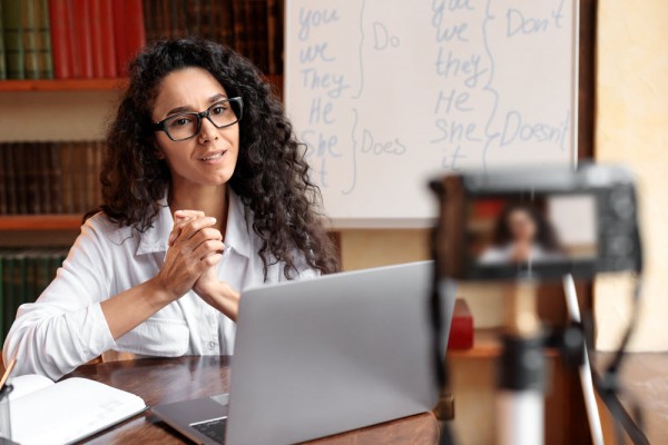 An instructor records herself teaching an online class