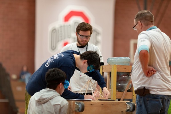 decorative image of students working on a science project