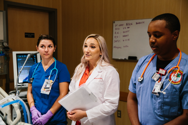 Three doctors in a patient's room