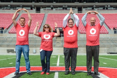 Four teachers from Dublin City Schools do the O-H-I-O pose while wearing CRO T-shirts.