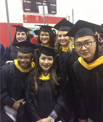 Group of students in graduation caps and gowns.